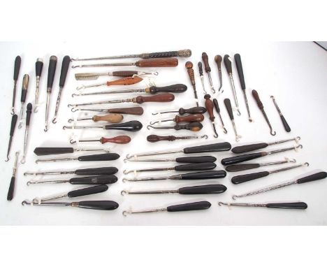 Group of thirty vintage ebonised handle and steel hook button hooks, four with silver mounts together with twenty treen handl