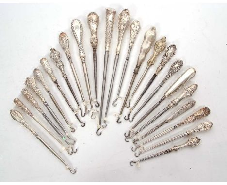 A group of twenty two late 19th/early 20th Century silver handled button hooks (steel hooks) various dates and makers togethe