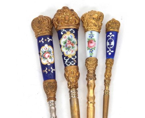 Four late 19th Century gilt metal and hand painted porcelain button hooks in sevres style, 10-18cm long