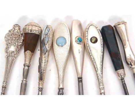 Four silver and stone set long handled button hooks to include a Liberty &amp; Co example, set either side with a small turqu