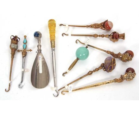 Group of ten novelty button hooks, two figural and stone set, a hand and stone example together with seven others