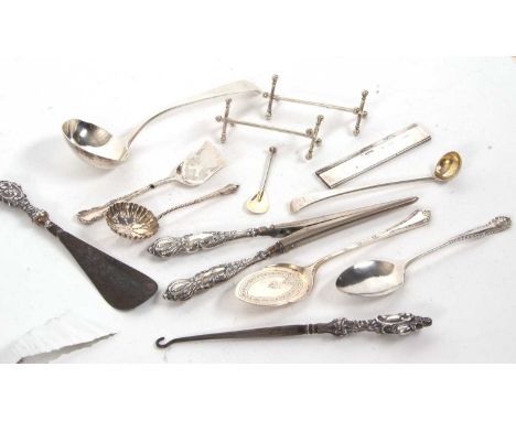 Mixed Lot: George III silver sauce ladle, a pair of Victorian silver knife rests, a Victorian long handled condiment spoon, t