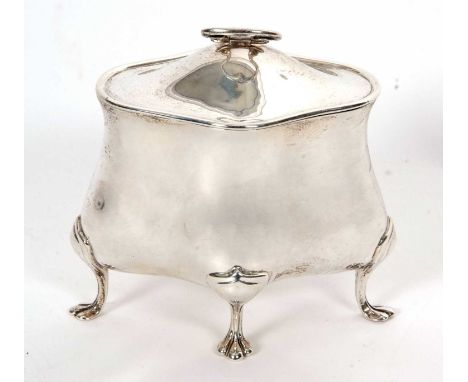 An Edwardian silver caddy in Bon-Bonnier style of plain design with hinged lid and loop carrying handle, supported on four sp