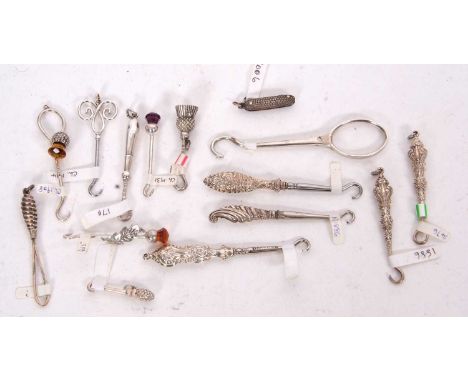 A group to include a George III hallmarked silver button hook hallmarked for London 1800, makers mark Samuel Pemberton, 9cm l