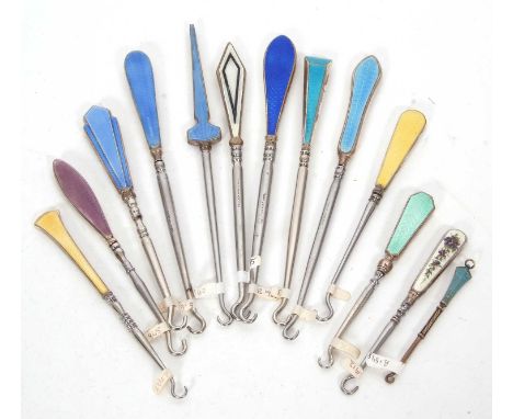 A group of thirteen mostly early 20th Century silver and enamel button hooks, various coloured gilouche enamel handles and ma