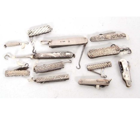 A group of six Victorian silver cased folding button hooks, four with knife blades and hallmarked Birmingham 1887, 89 and 90,