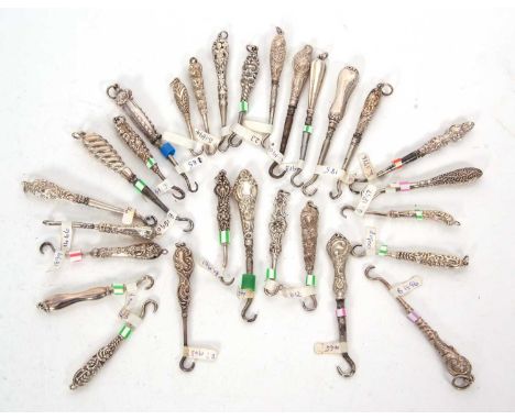 Group of twenty four late 19th/earlyh 20th Century silver and steel small button hooks, various dates and makers together wit