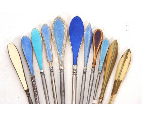 A group of six early 20th Century silver and enamel handled button hooks (steel hooks) with shades of blue guilloche design e
