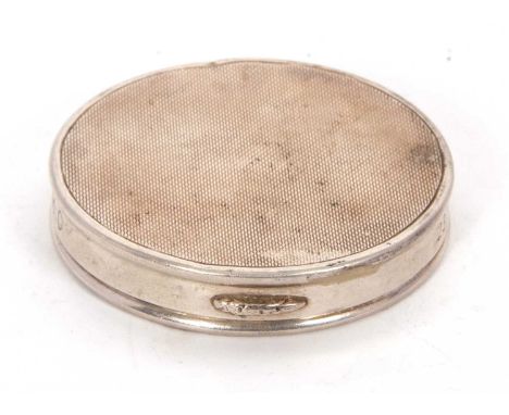 A hallmarked silver ladies compact of circular form, engine turned decorated lid with plain sides, engraved with initials and