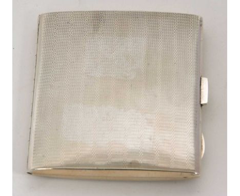 An Art Deco silver cigarette case of rectangular form, engine turned decorated with push button mechanism and applied thumb p