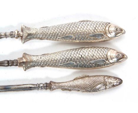 A group of three button hooks with steel shafts,a pair with fish decorated handles, makers mark only and Victorian registrati
