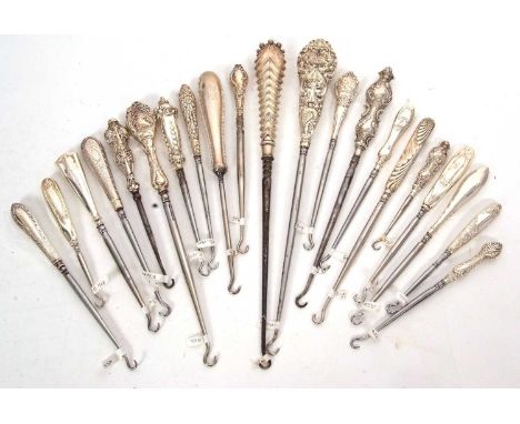 Group of twenty one late 19th/early 20th Century silver and steel button hooks, various dates/makers, 12-29cm