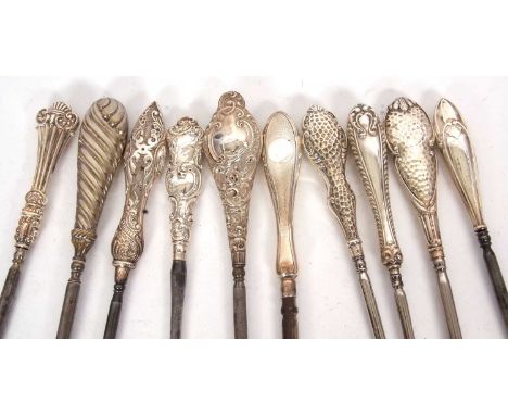 Group of nine early 19th Century silver handled button hooks, various dates/makers together with a silver plated example, 22-