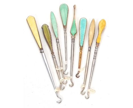 Group of eight early 20th Century enamel and silver handled button hooks, various coloured gilouche enamels, dates and makers