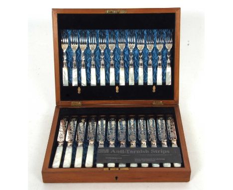 Late Victorian silver-plated and mother of pearl handled fruit set for twelve, having engraved blades and tapering polished a