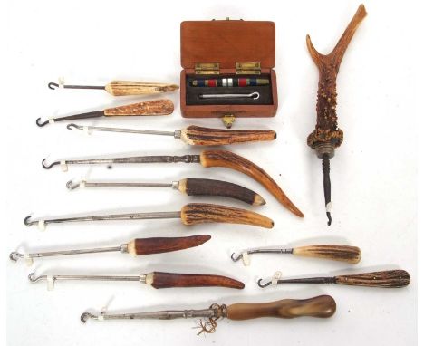 Group of twelve stag horn handled vintage button hooks together with a cased two part button hook