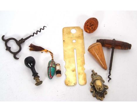 Mixed Lot: An antique carved coquille nut box, two vintage corkscrews, an antique brass military button cleaning uniform prot