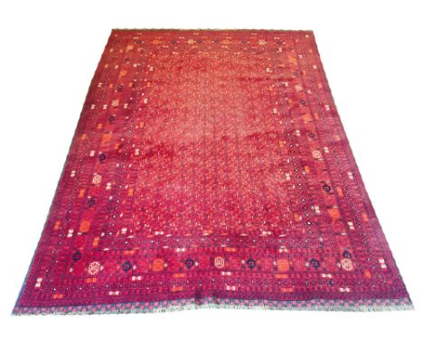 FINE AFGHAN BASHIR CARPET, 300cm x 200cm, all over Mina Khani design on a ruby field within corresponding bands and borders.