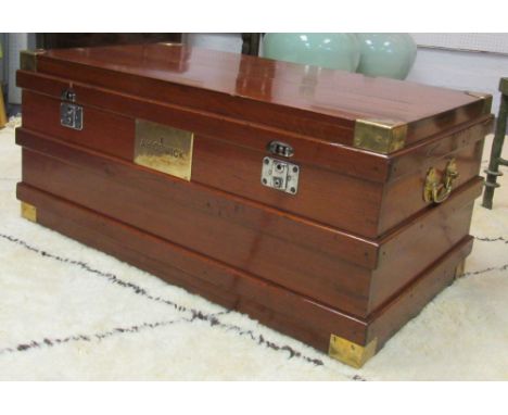 CAMPAIGN STYLE TRUNK, early 20th century teak and brass bound with a plaque to the front and a rectangular rising top enclosi