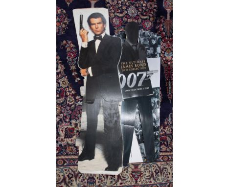 Various James Bond 007 cinema standing props including Pierce Brosnan.