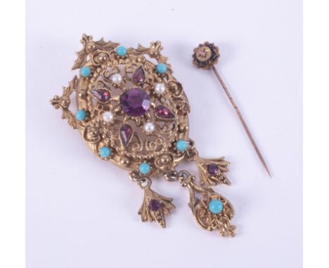 An ornate costume jewellery brooch/pendant set with faux stones and a 15ct yellow gold stick pin, 0.82gm, (2).