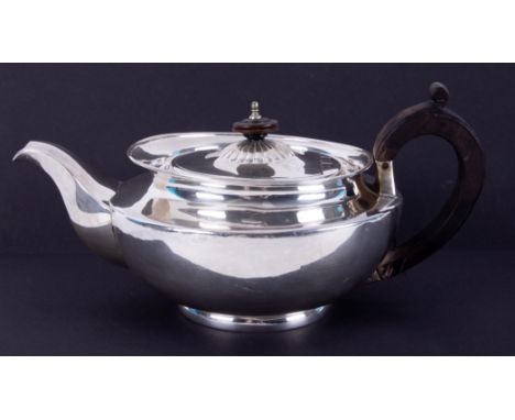 A Victorian silver teapot, London, maker I.T, stamped Green &amp; Co, approx. 22.78oz.