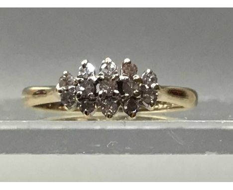 DIAMOND CLUSTER RING,set with small round diamonds, in nine carat goldThey are diamond chips, the condition of the diamonds i