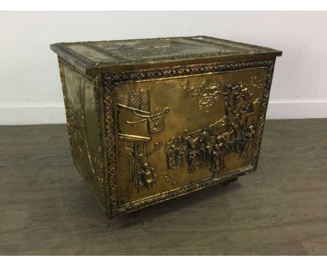BRASS COAL BOX,the box lid embossed with a scene of Ann Hathaway's cottage, 51cm wide, along with a brass magazine rack and a