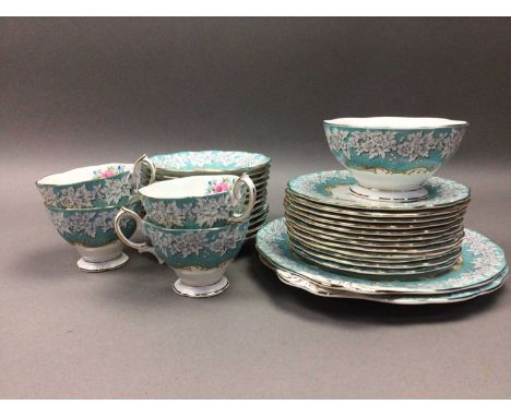 ROYAL ALBERT 'ENCHANTMENT' PATTERN TEA SERVICE,comprising twelve cups, saucers and side plates, two biscuit plates, sugar and