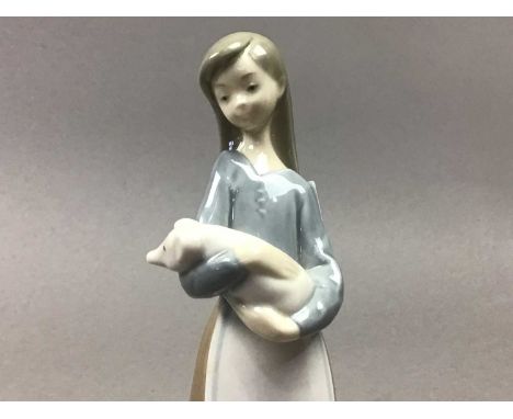 LLADRO FIGURE OF A GIRL WITH A PIG,18cm high,along with a Lladro model of a dog and other Nao and Hummel figures