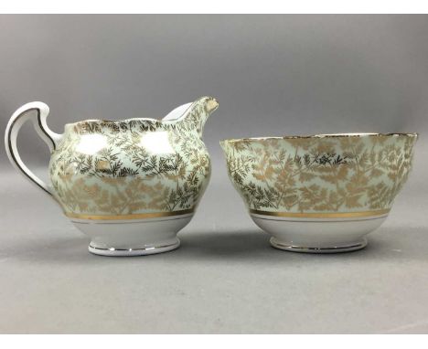 HARLEQUIN PART TEA AND COFFEE SET, 'Clare' pattern and marks to base, comprising a jug, bowl, cups, plates and saucers, along