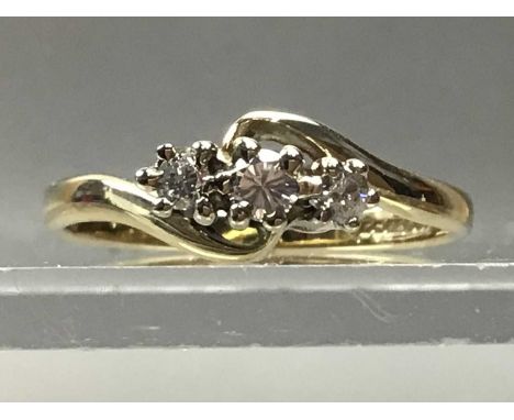 DIAMOND THREE STONE RING,set with three small diamonds, in nine carat goldRing is size K, there diamond chips, diamonds have 