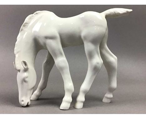 COLLECTION OF EIGHT PORCELAIN HORSE FIGURES,including Black Beauty by Franklin Mint, 21cm high, along with a donkey and a fem