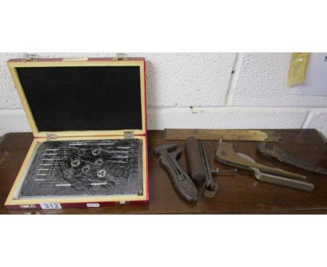 Small collection of military engineering tools to include tap and die, wooden cased air pressure gauge (1943) and Aircraft Ma