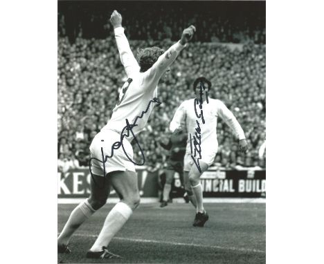 Mick Jones and Eddie Gray signed 10x8 b/w photo playing for Leeds.  Good Condition. All signed pieces come with a Certificate