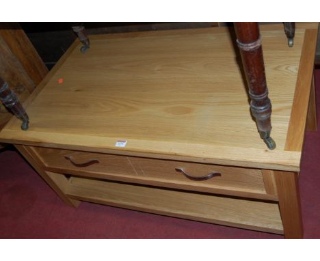 A contemporary light oak single drawer two-tier rectangular coffee table, w.99cm