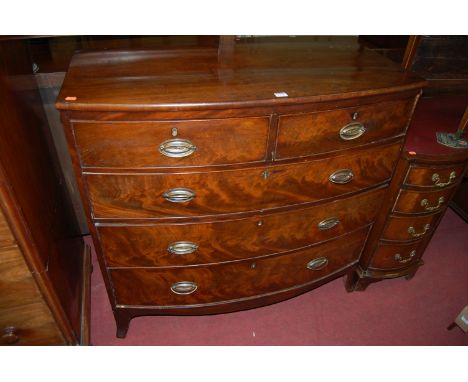 A mid 19th century mahogany and flame mahogany bow front chest of two short over three long drawers, width 107cm