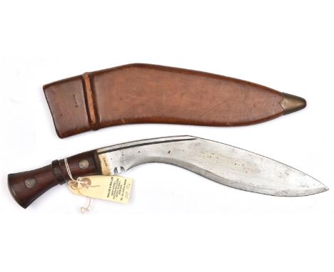 A WWII military kukri, blade 12”, with short back fuller, stamps at forte (partly erased), wooden grips with brass studs and 