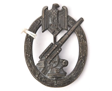 A Third Reich Army Flak badge,   bearing the HAD mark of Hermann Aurich, Dresden, with very dark grey/black finish. VGC (the 