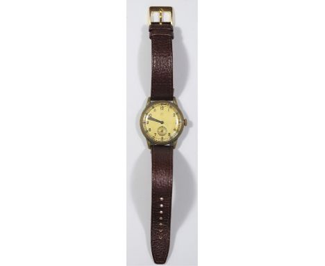 KM marked Berg wristwatch. Plated case, almost all plating removed leaving brass finish, 35mm without crown. Snap back marked