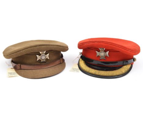 An officer's scarlet peaked cap, with enamelled ERII Maltese Cross badge of The Light Dragoons, embroidered peak, R Crest but