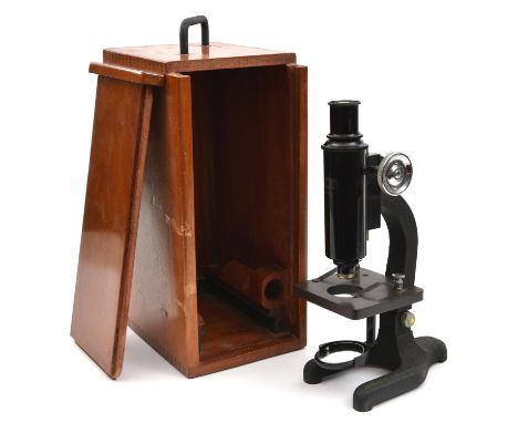 A Monocular microscope by Hall Bros. Croydon. An optical reflective microscope with a 10x eye piece and 2cm lens. In a fitted