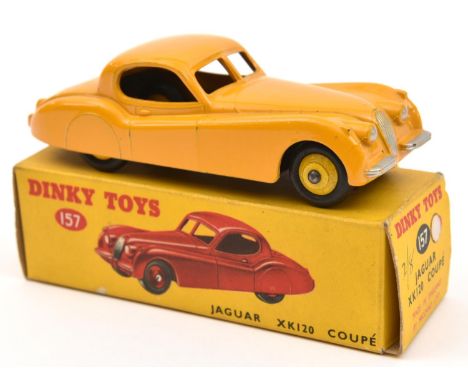 A Dinky Toys Jaguar XK120 Coupe (157). In yellow with light yellow wheels and black rubber tyres. Boxed, minor wear/marks. Ve