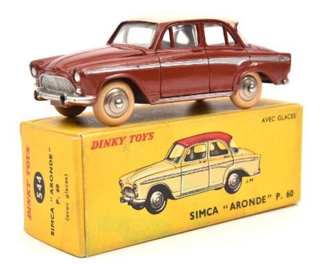 A French Dinky Simca Aronde P.60 (544). In brick red, with silver side-flash and pinkish cream roof. Boxed, some light staini