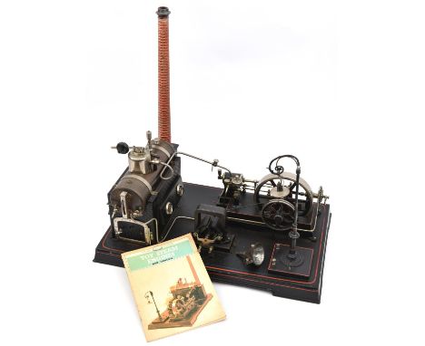 A Doll &amp; Co. live steam tinplate horizontal electricity generating steam plant. A boiler with whistle, safety valve, wate