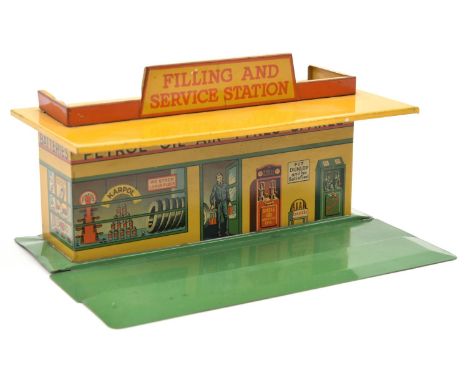 A Dinky Toys Filling and Service Station (48). A tinplate station with green base, yellow roof and walls. 'Filling and Servic