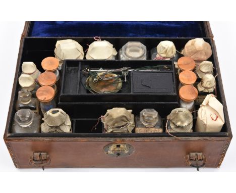 A late 19th Century English travelling apothecary set by the chemists Savory &amp; Moore. A leather cased set with key, conta