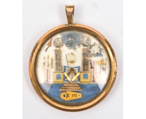 Masonic Interest:  a small circular masonic pendant, diam 41mm, depicting the all seeing eye, temple, trowel, compass, mallet