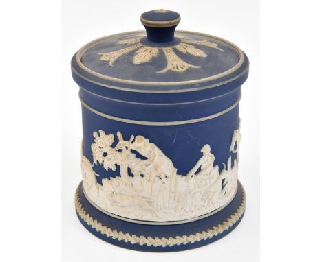 A Staffordshire jasperware pot by William Adams of Tunstall. A lidded pot in blue and white with hunting scene. GC, chip to r