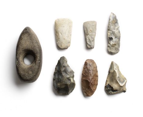  A group of four Palaeolithic and three Neolithic stone and flint implements Circa 2000 B.C. and earlierComprising a pointed 